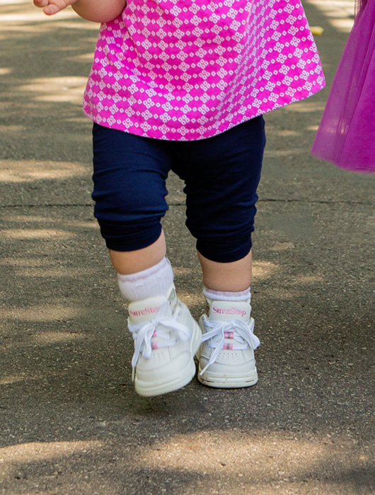 pink trim athletic shoe Surestep