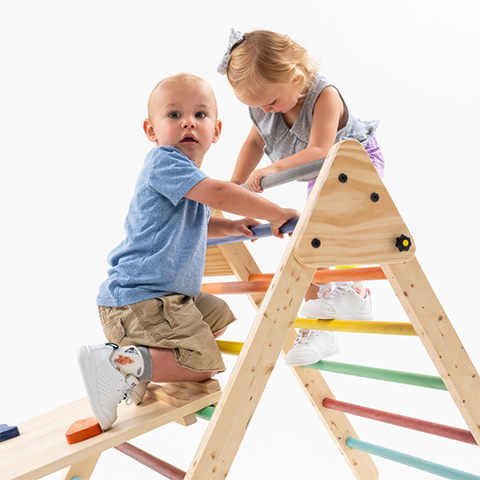 Toddlers playing together while wearing SMO orthotics