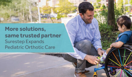 An orthotist crouches down to adjust a child's ankle-foot orthosis (AFO). Grey text on a blue background reads "More Solutions, Same Trusted Partner: Surestep Expands Pediatric Orthotic Care."